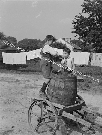 BOYS WITH WATER BARREL